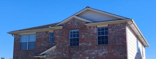 Upper brick facade and trim before exterior painting, Houston.