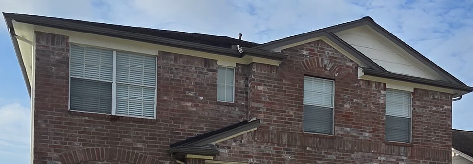 Upper brick facade and refreshed exterior trim, Houston.