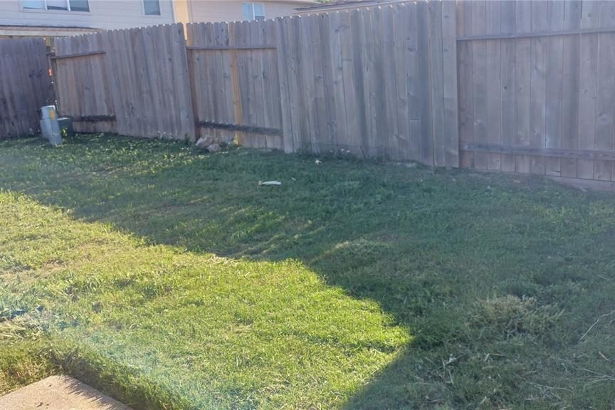 Backyard fence before replacement.